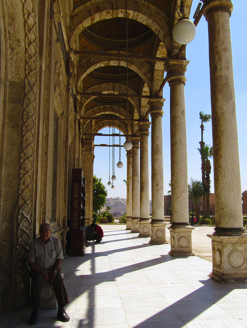 Corridor of arches along the exterior of the mosque.