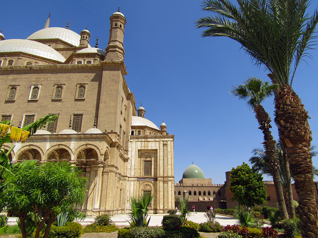 A peek of the green-domed Al-Nasir Muhammad Mosque behind Muhammad Ali.