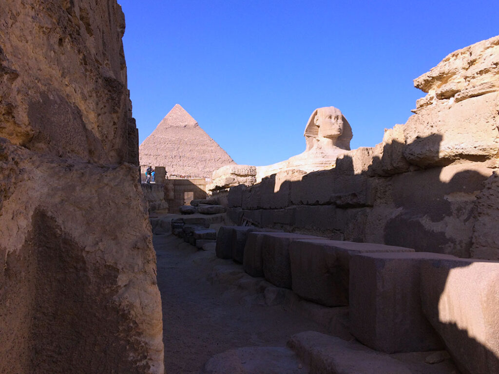 Coming around a corner near the entrance of the Sphinx Temple, the Great Sphinx and Khafre's Pyramid peeked through the ruins.