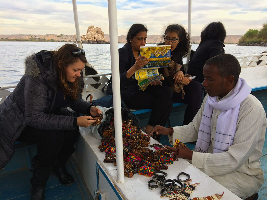 On our way to Agilika Island, the ferry boat captain brought out bracelets and other trinkets for sale.